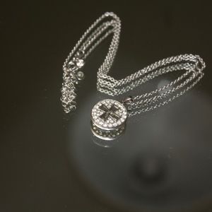Pave Diamonds and white gold cross pendent